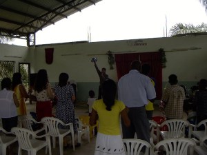 We are standing and praising God in song.