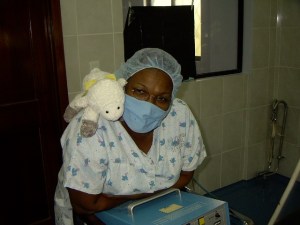 Maria Luisa was posing with the little lamb that each child receives as a gift from the clinic.
