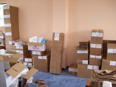 Lots of boxes full of supplies that need sorted and distributed