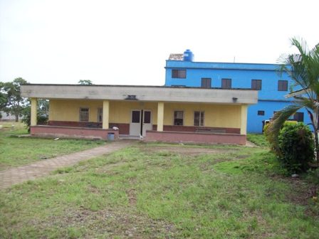 The original clinic building with the new clinic behind it